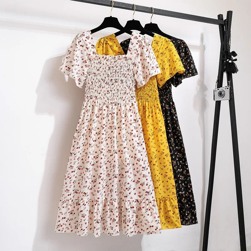 Thea smocked floral midi dress with flutter sleeves