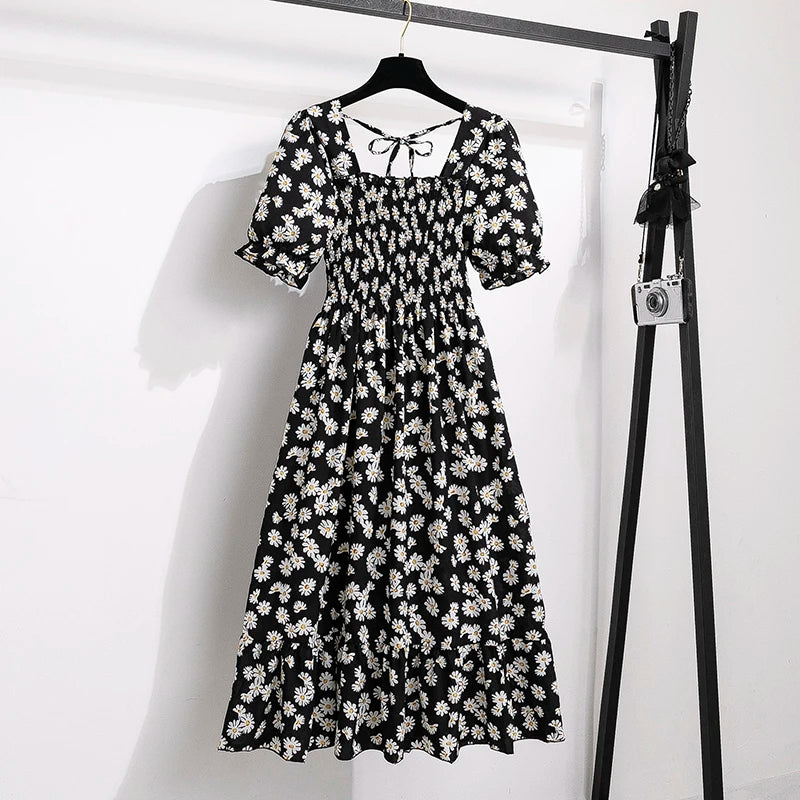 Rosaria smocked floral midi dress with puff sleeves in black daisy
