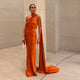 Brunella one-shoulder satin maxi dress with cape sash in orange